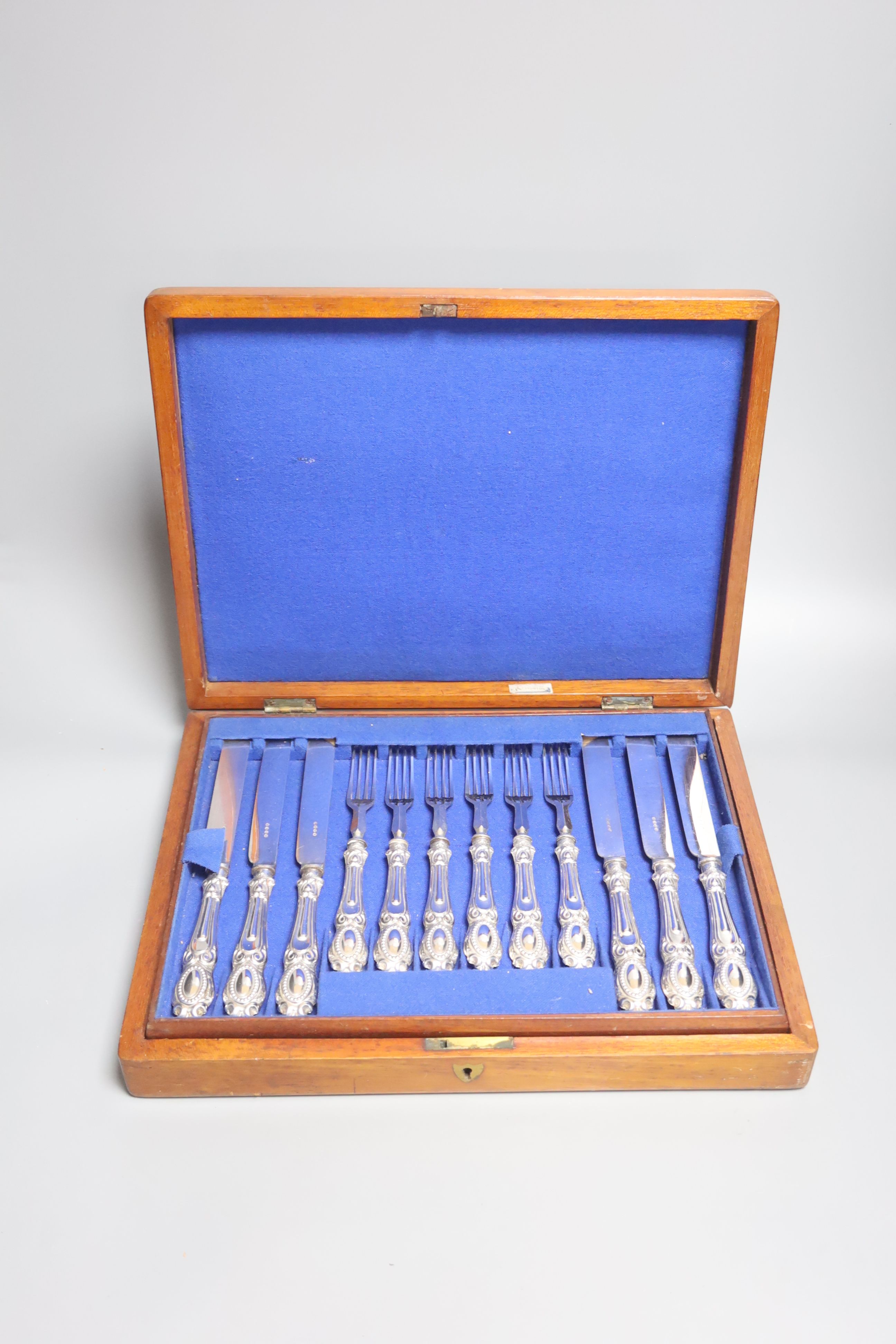 A cased set of twelve plated dessert knives and forks